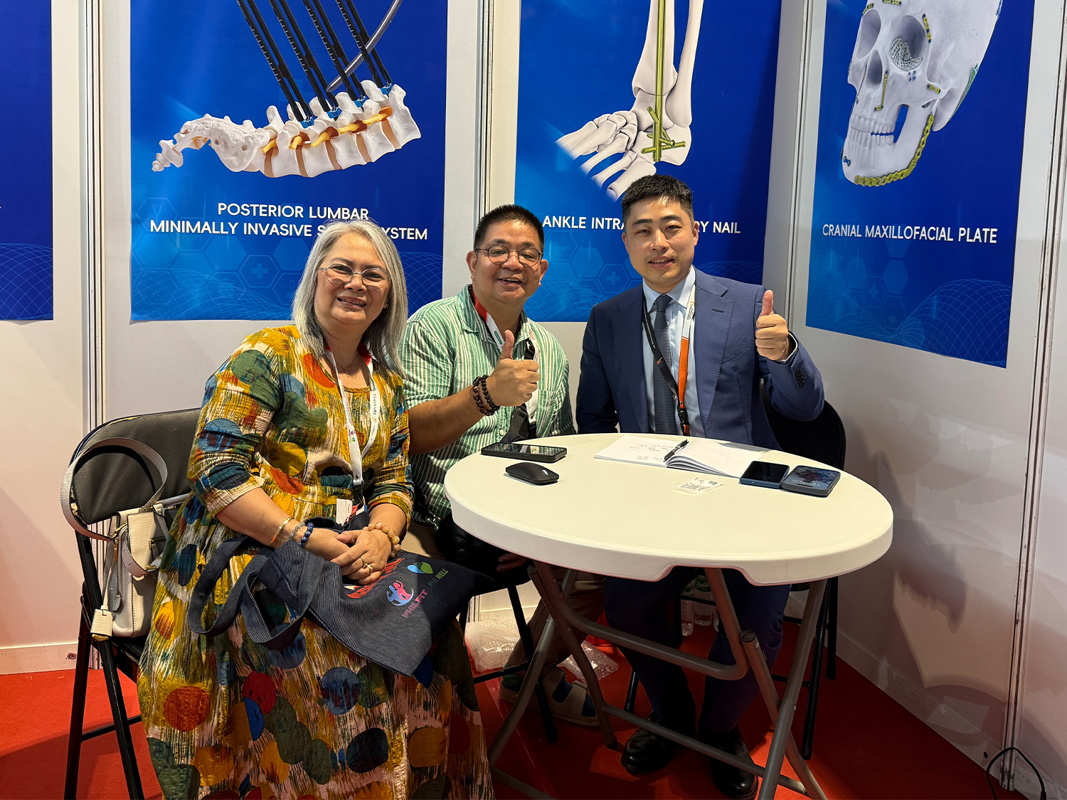 CZMEDITECH team discussing orthopedic solutions with exhibition visitors in Manila